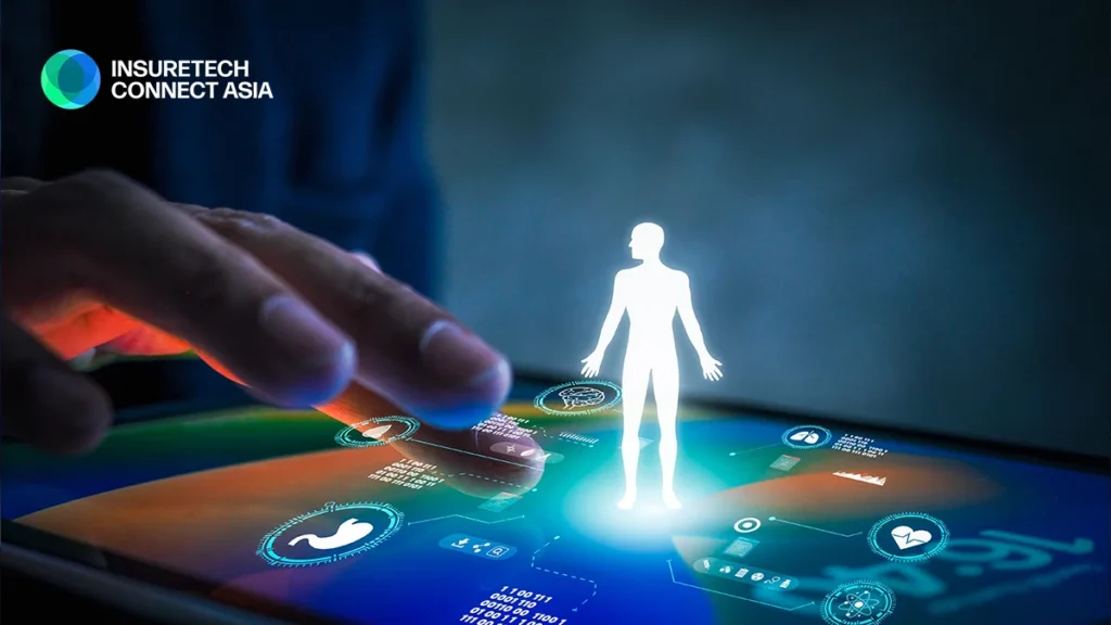 Glowing white human silhouette hovering above a futuristic touchscreen with holographic UI, InsureTech Connect Asia logo in the corner.