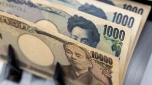 Fanned Japanese yen banknotes, showing 1,000 and 10,000 yen bills, close-up view of the currency stack