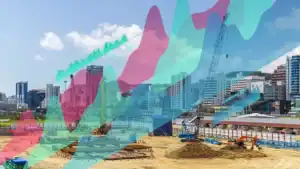 City construction site with cranes and dug earth, overlaid by colorful data graphs.