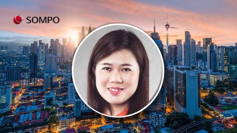 Claire Chin, APAC risk management head, in front of Singapore skyline.