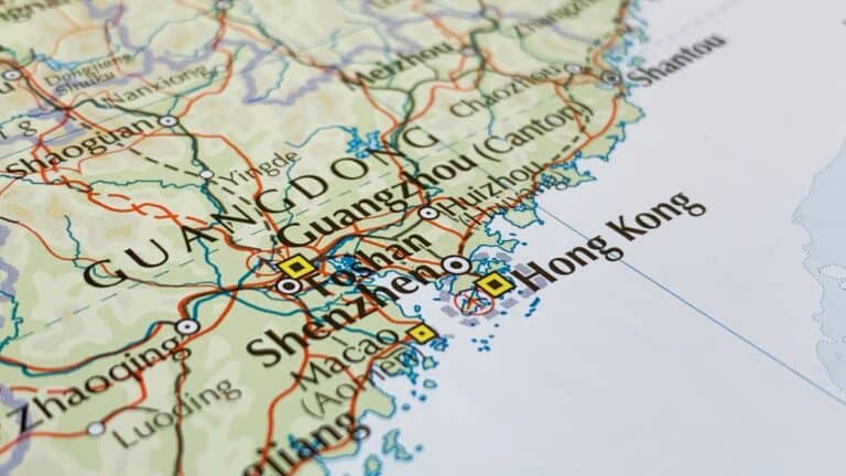 Close-up map of southern China showing Guangzhou, Shenzhen, and Hong Kong with road lines and coastlines.