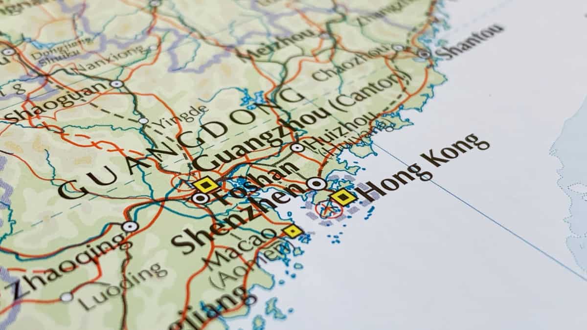 Close-up map of southern China showing Guangzhou, Shenzhen, and Hong Kong with road lines and coastlines.