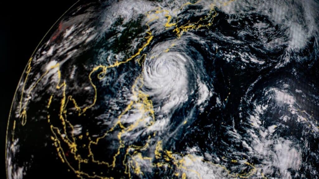 Satellite image of a large hurricane swirling over the western Pacific near the Philippines and East Asia.