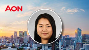 Kayo Montgomery, Asia strategic account manager at Aon, in front of a city skyline at sunset.