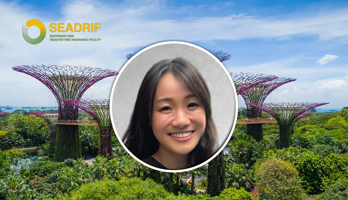 Circular portrait of a smiling woman over a background of Gardens by the Bay Supertree Grove and the SEADRIF logo on the top left.