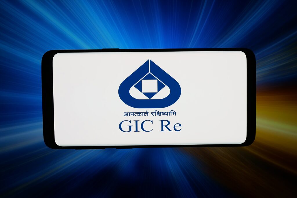 Smartphone screen showing the GIC Re logo on a white background with blue icon and Hindi text beneath.