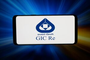 Smartphone screen showing the GIC Re logo on a white background with blue icon and Hindi text beneath.
