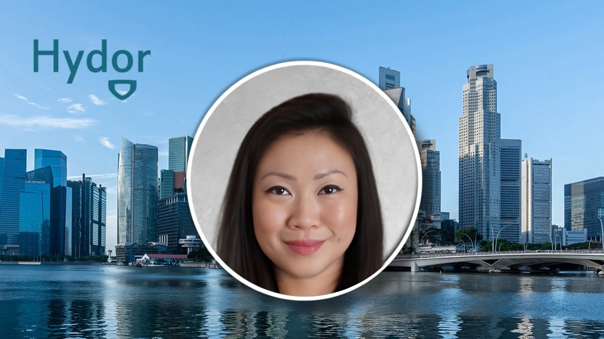 Marilyn Lim, claims handler at Hydor, in Singapore with city skyline background.