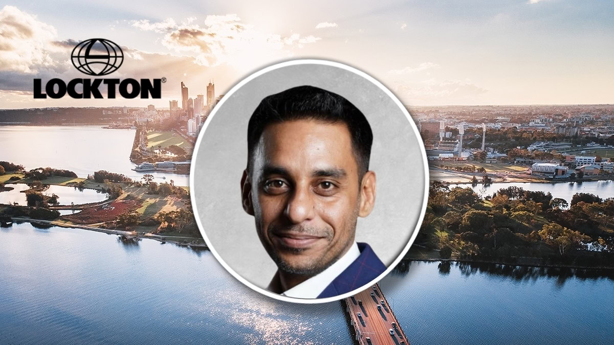 Smiling man's headshot in a circular frame over a cityscape with the Lockton logo in the sky.