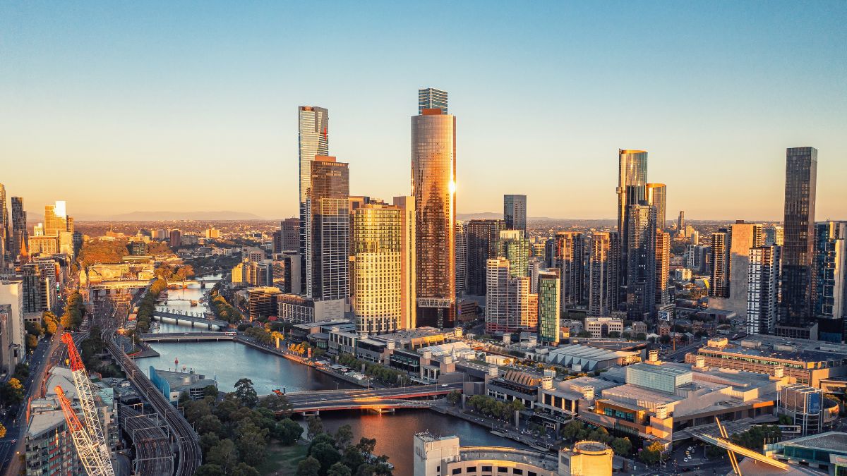 Sydney skyline with skyscrapers and Harbour Bridge at sunset, Australia.