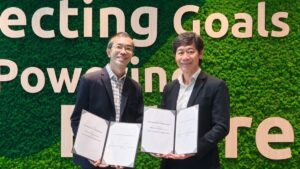 MSIG teams up with newly launched cybersecurity association to boost cover for SMEs Two men in suits hold signed documents at a Singapore event for MSIG and CASL.