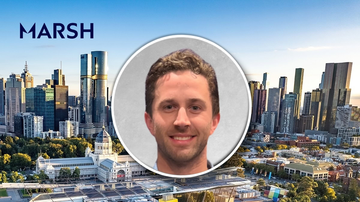 City skyline with high-rise buildings and a large circular portrait of a smiling man overlaid in the center, with the MARSH logo visible on the left.