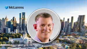 McLarens logo with a city skyline background and a circular headshot of a smiling man in the center.