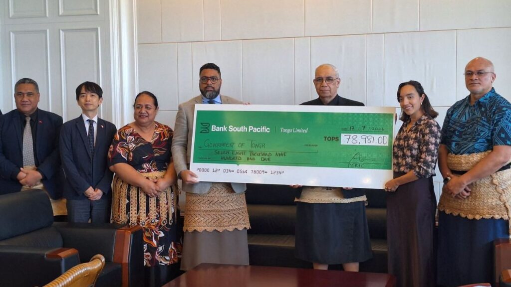 Tonga officials receive a cheque from Bank South Pacific for drought relief funds.