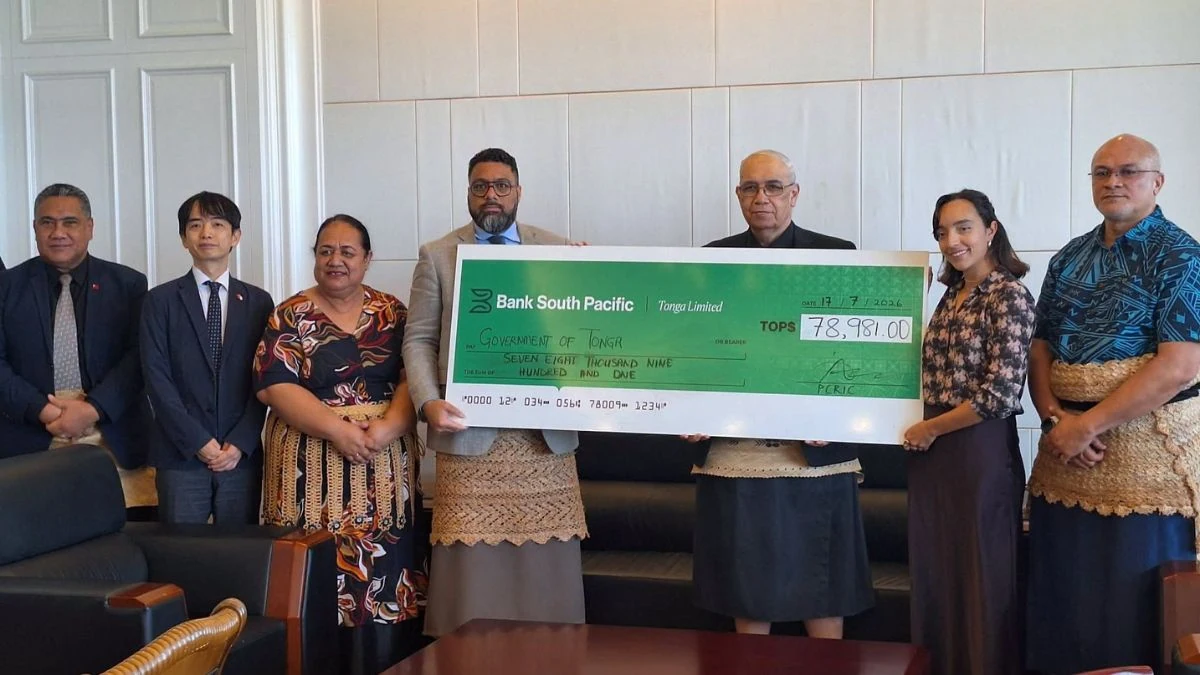 Tonga officials receive a cheque from Bank South Pacific for drought relief funds.