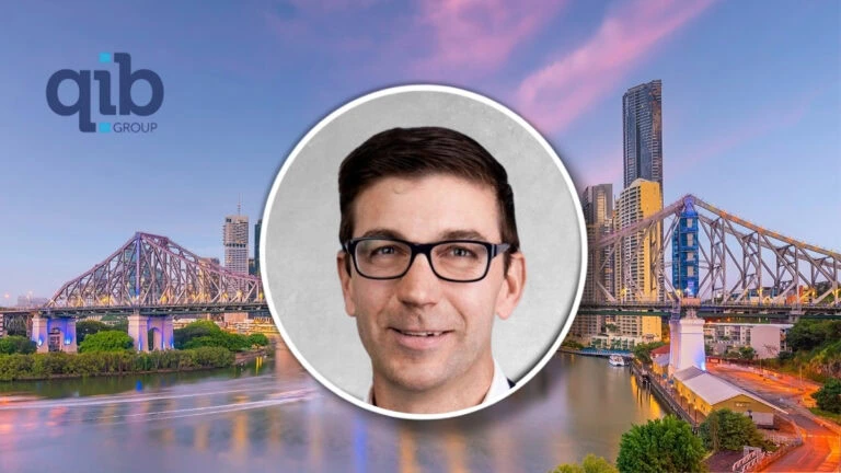 Alan Moran with Brisbane skyline and Story Bridge in the background.