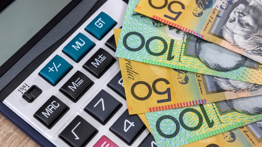 Australian dollar notes and calculator, related to superannuation and financial claims.