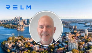 Relm branding above Sydney Harbour skyline with a circular headshot of a smiling man in the center