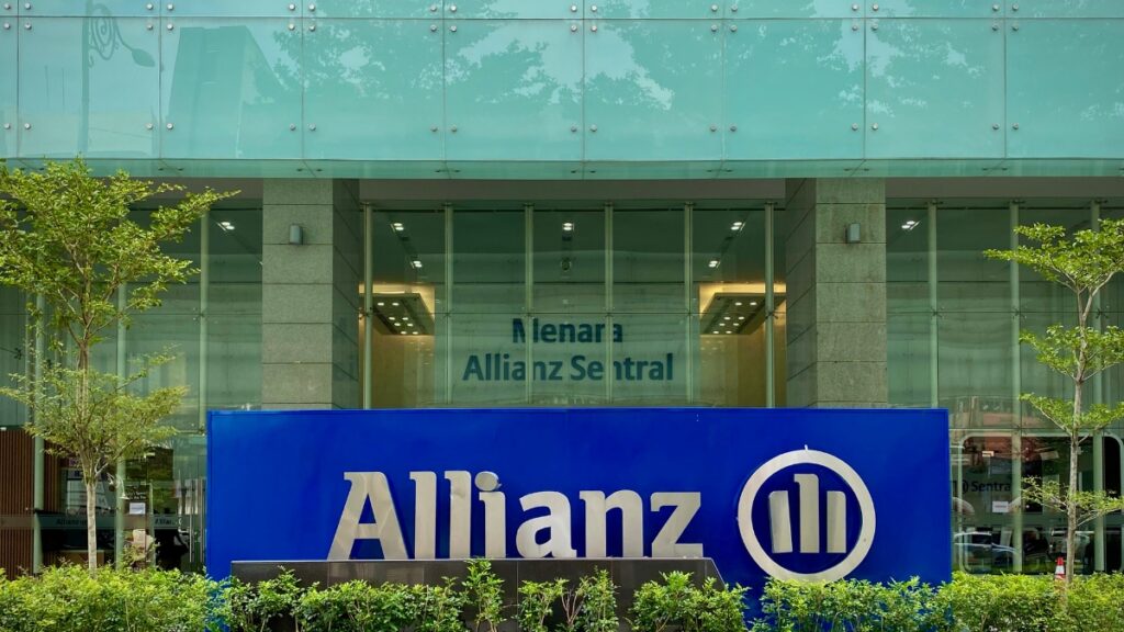 Exterior view of Allianz building with a large blue sign reading Allianz in the foreground