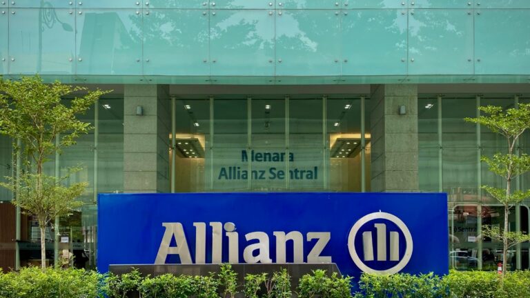 Exterior view of Allianz building with a large blue sign reading Allianz in the foreground