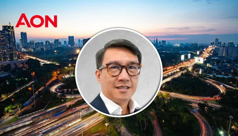 Stephen, Indonesia CEO, appointed by Aon, in front of Jakarta skyline.