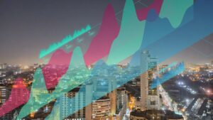 Night cityscape at night with colorful semi-transparent line and area charts overlaid, suggesting data trends over time.