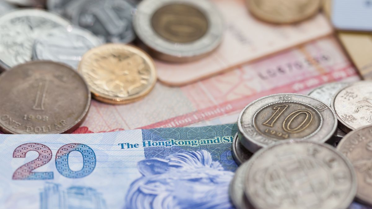 Hong Kong dollar and Chinese yuan coins and banknotes, reflecting offshore finance.