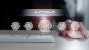 GIAJ cautions against overly prescriptive AI governance requirements AI governance concept with glowing hexagonal icons hovering above a keyboard and mouse.