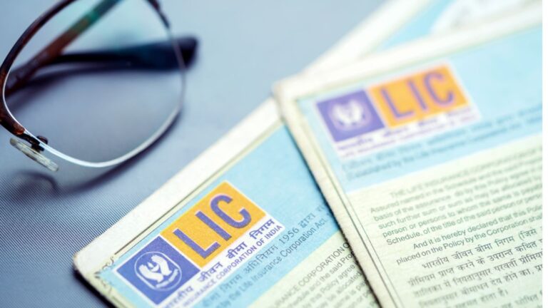 LIC insurance policy documents with LIC logo and glasses on a blue background.