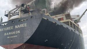 The cargo ship Mayuree Naree from Bangkok with smoke rising from the engine room.