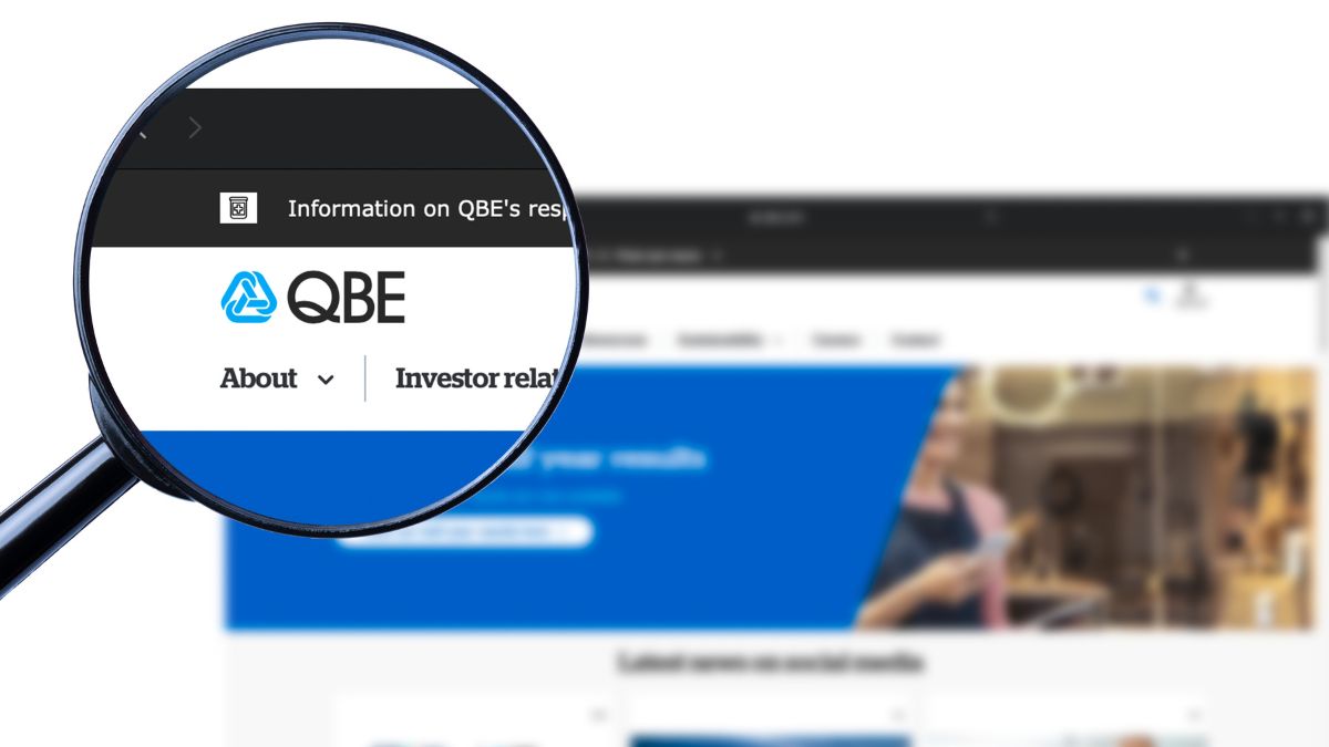 Magnified view of QBE website header with logo and 'About' and 'Investor relations' navigation links.