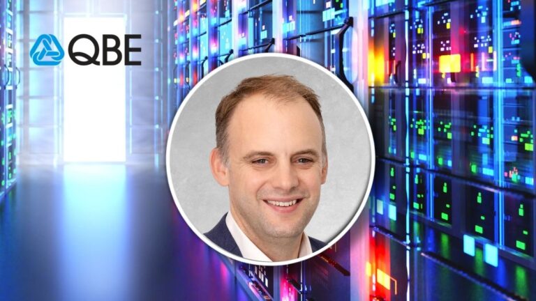 Portrait of a smiling man in a circular frame over a data center background with server racks; QBE logo visible on left.