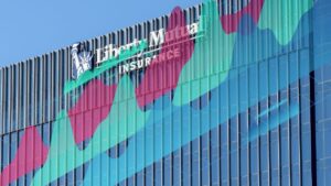 Liberty China building with insurance company logo, reflecting industry growth.