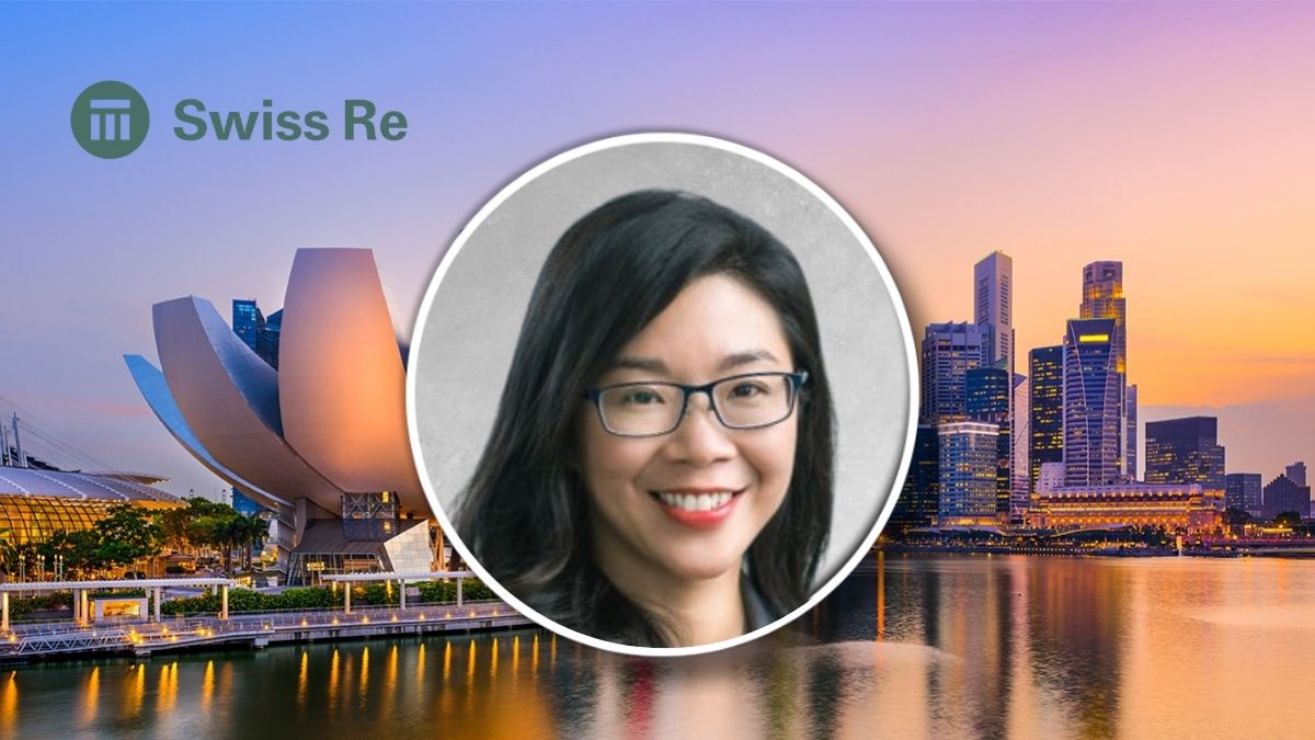 Karen Tan, Swiss Re's chief underwriter for life & health, in front of Singapore skyline.