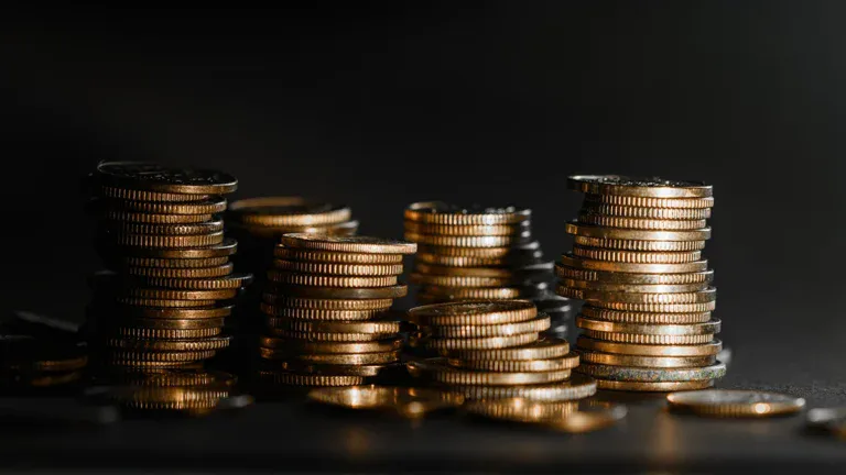 Stacks of coins representing investment growth in China and the US.