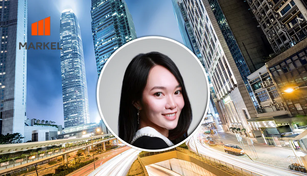 Smiling woman portrait in a circular frame centered over a city skyline with the MARKEL logo in the upper left, a professional header image.