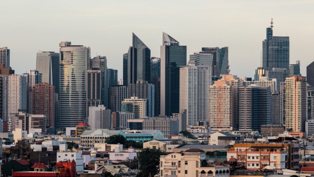 Philippine city skyline with modern skyscrapers and high-rise buildings.