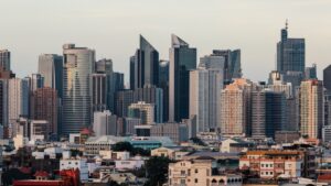 Philippine city skyline with modern skyscrapers and high-rise buildings.