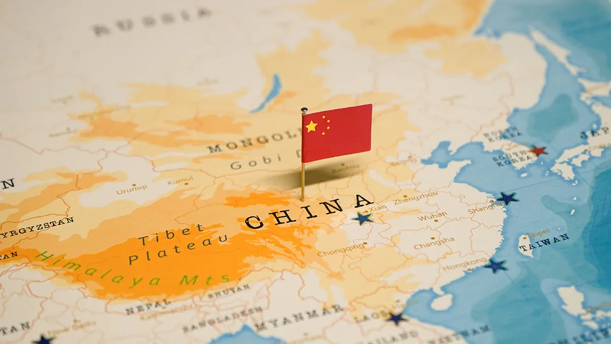 Map showing China and surrounding regions affected by Typhoon Dolphin, with Chinese flag.