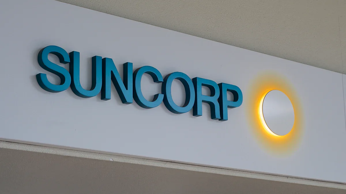 Suncorp logo with a yellow circle, related to Australian insurance company.