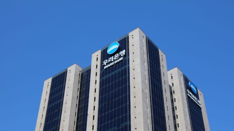 Woori Bank building in South Korea with blue sky background.