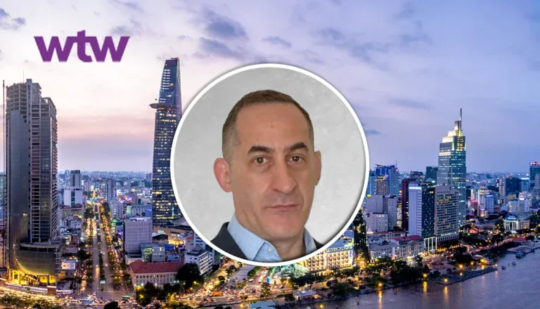 Andrew Morgan, new leader for expatriate and high-end medical in Asia Pacific, in front of a citysky.