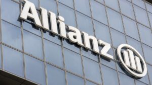 Allianz logo on a modern glass building in the UK.