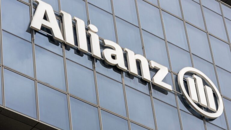 Allianz logo on a modern glass building in the UK.