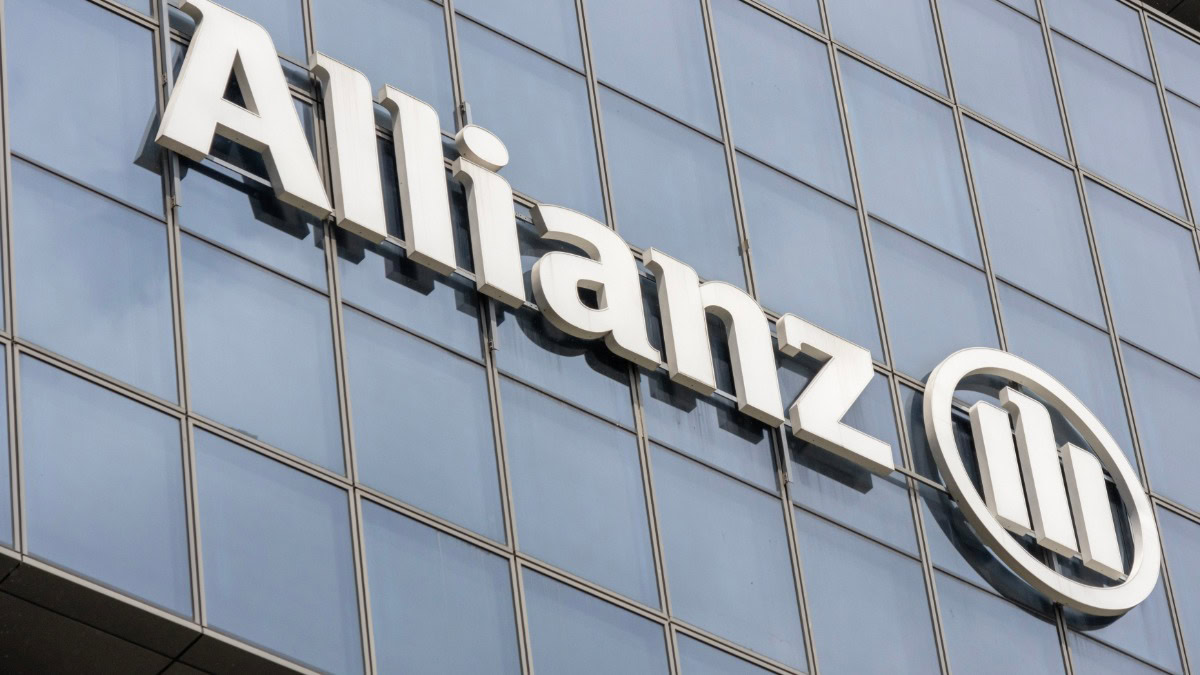 Allianz logo on a modern glass building in the UK.