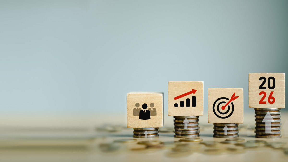 Business growth and success icons on wooden blocks with coins.