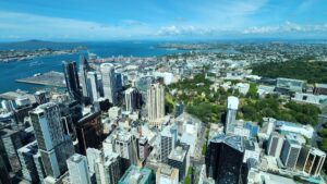 Aerial view of Auckland city skyline, New Zealand, with skyscrapers and harbour.