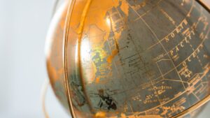 Strong capital and underwriting discipline support global non-life reinsurance sector: AM Best Close-up of a vintage globe showing parts of Asia and Australia.