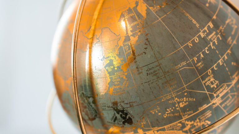 Close-up of a vintage globe showing parts of Asia and Australia.