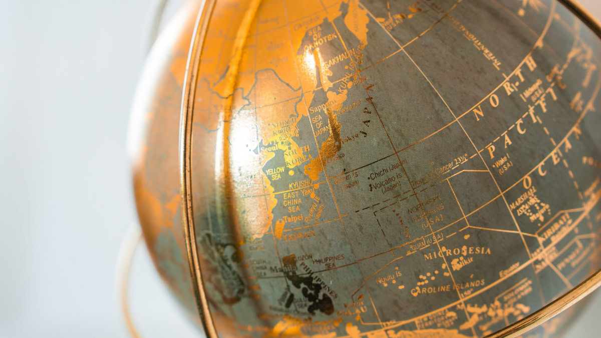 Close-up of a vintage globe showing parts of Asia and Australia.
